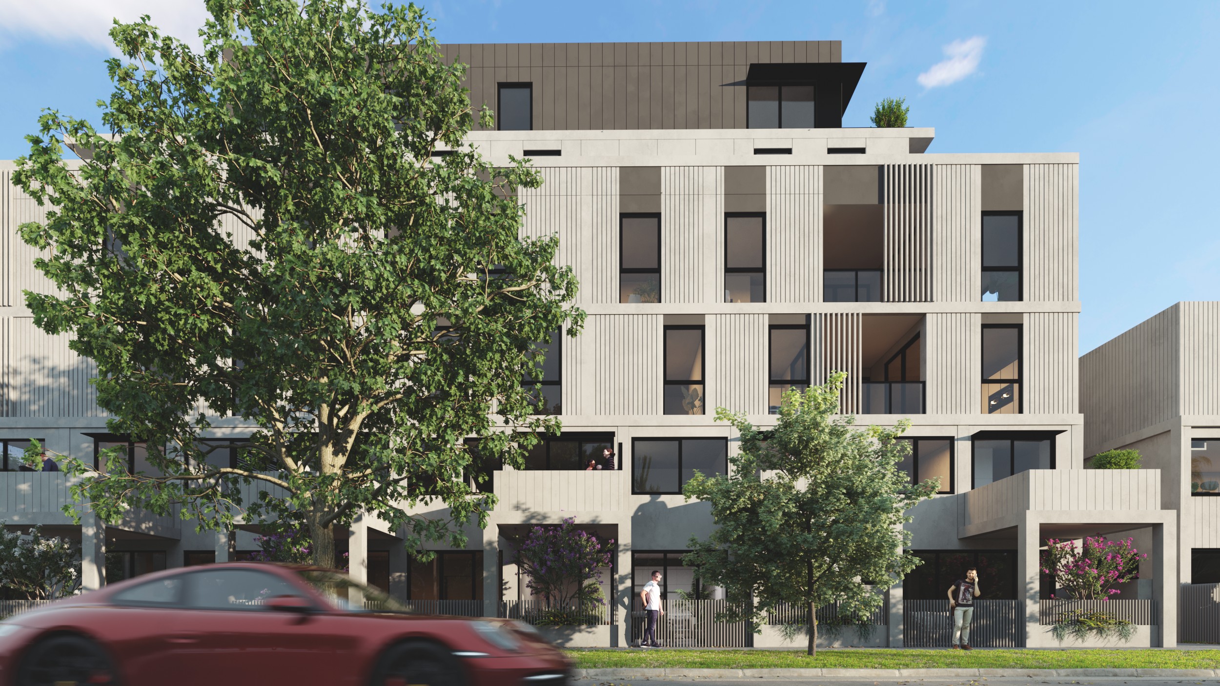 Oakleigh apartment facade with a tree in front and car passing by